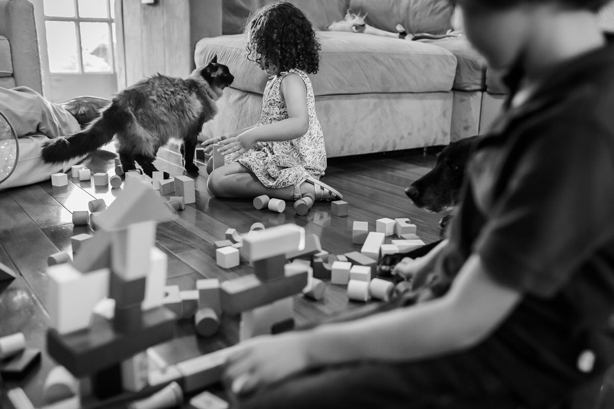 family playing toy blocks