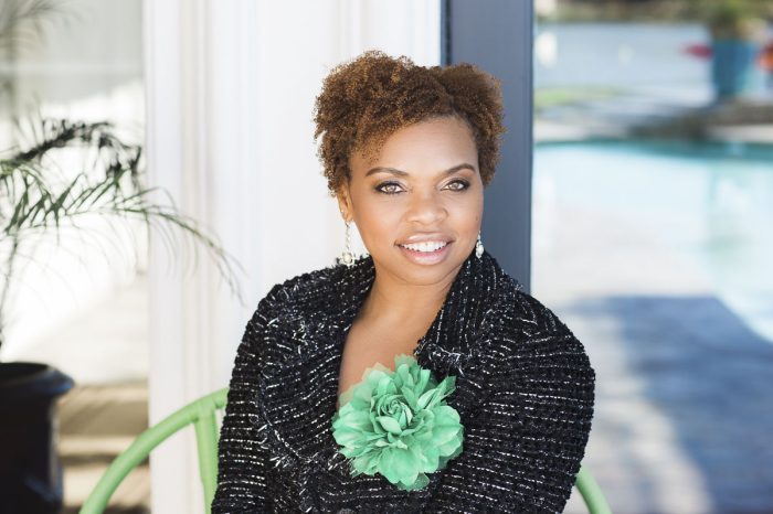 woman of color wearing black blazer